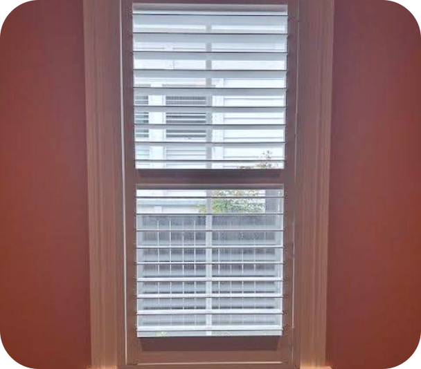 Rectangle 3 Half-closed Timber Basswood Blinds with a white window frame in a heritage home in Mt Eden.