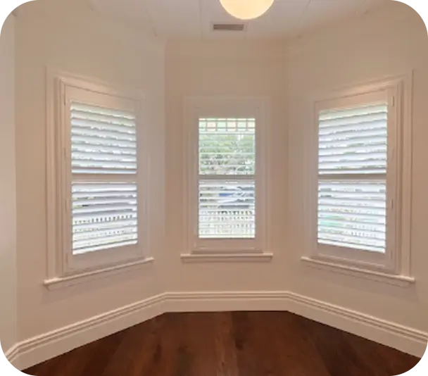 Three windows with open Timber Basswood Blinds with 89mm blades in Mt Eden, custom made and installed.