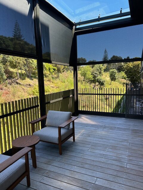 black-frame-motorised-blinds-ponsonby Motorised outdoor blinds with black frames, providing weather protection for a Ponsonby hospitality space.